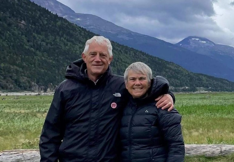 Pastor Bert & Diane Slofstra (field and mountains in background)